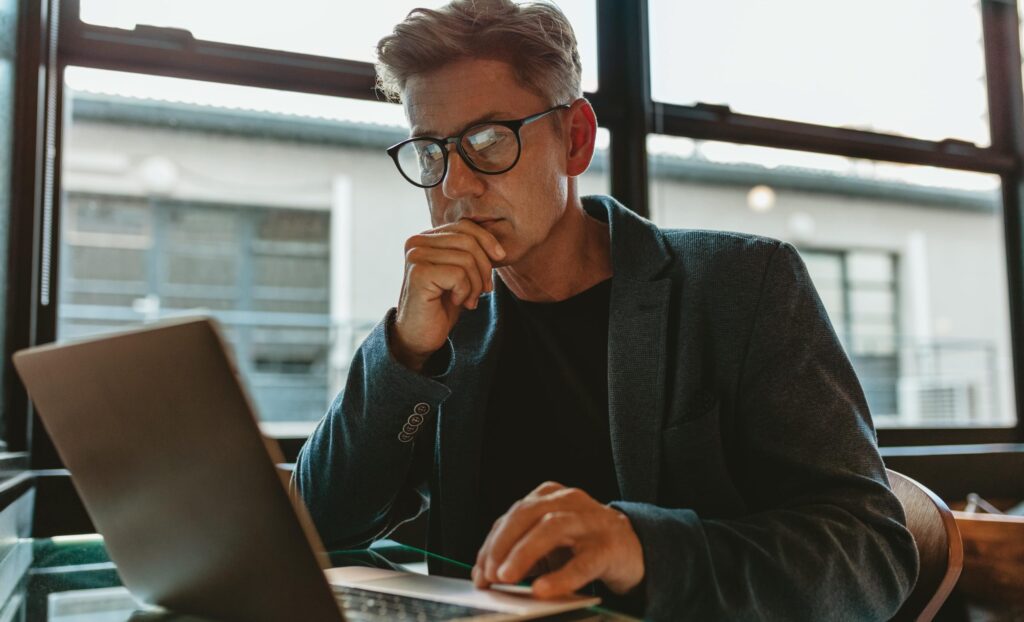 Business man working on his laptop in an office
