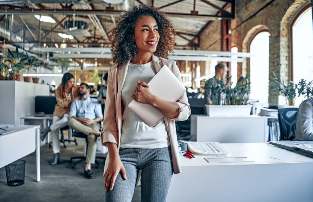 Group of young multiracial business people are working in modern office. Freelancers in coworking place. Creative and stylish youth.