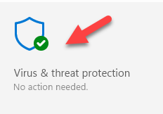 The screenshot shows a shield icon with a checkmark inside a green circle, labeled "Virus & threat protection: no action needed," with a red arrow pointing towards it.